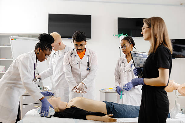 istock Medical students practicing cpr on a medical manikin during a medical training course 2226511154