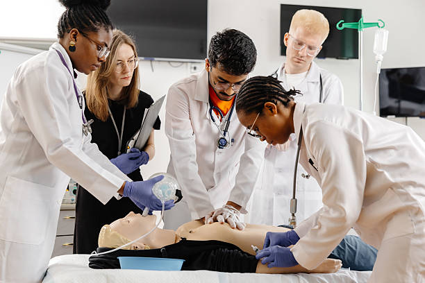 istock Doctors practicing cardiopulmonary resuscitation on a medical manikin 2226511170
