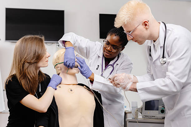 istock Medical Students Practicing Endotracheal Intubation on a Medical Mannequin 2226511198