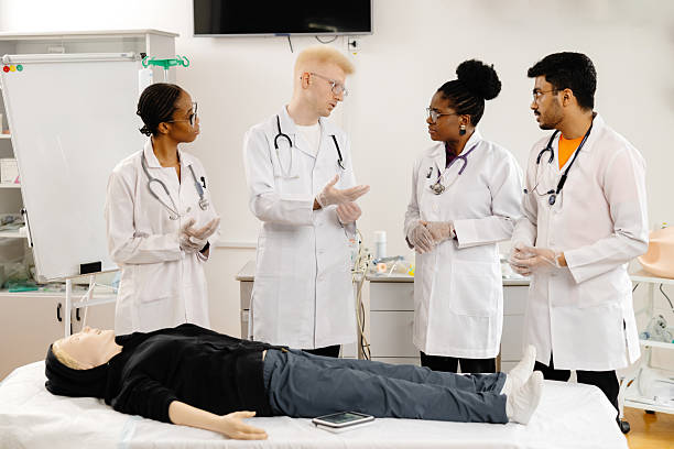 istock Medical Students Wearing Gloves During CPR Training on a Dummy 2226511253