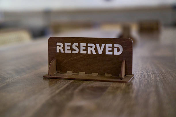 istock Wooden reserved sign on a table in a restaurant 2226511430