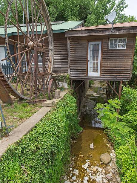 Jasper, Arkansas - USA, May 10, 2025. Paddle wheel and canal in Jasper Arkansas. Jasper a tiny community in the middle of the Ozarks along the Little Buffalo river and county seat of Newton county Arkansas.