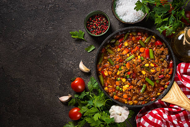 istock Chili con carne in skillet on dark stone table. 2226514590