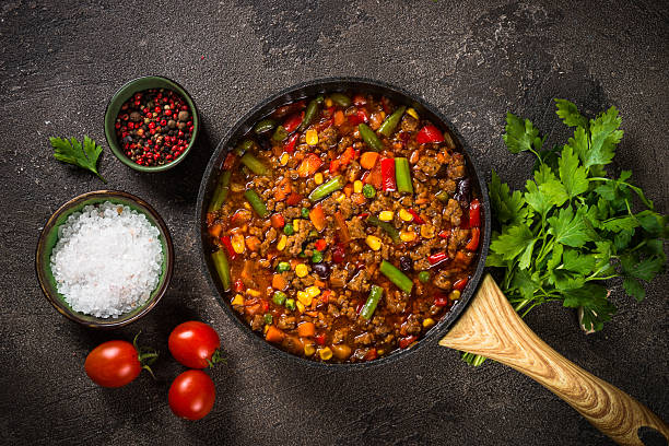 istock Chili con carne in skillet on dark stone table. 2226514599