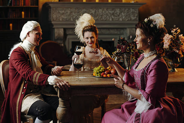 istock Caucasian Young Adults Socializing in Baroque Setting and Toasting with Wine 2226517721