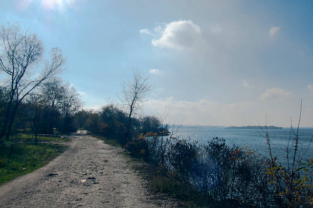 istock Path Along Shore: Walk Towards City Horizon 2226518017
