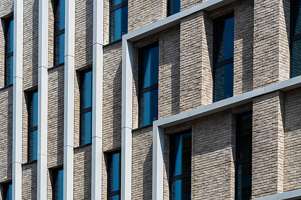 istock Brick and aluminum facade with vertical rhythm and light play 2226518432