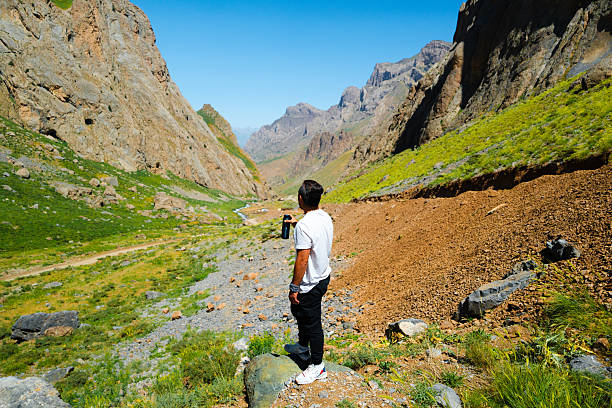 Young man enjoying breathtaking view of cilo mountains in hakkari, turkey