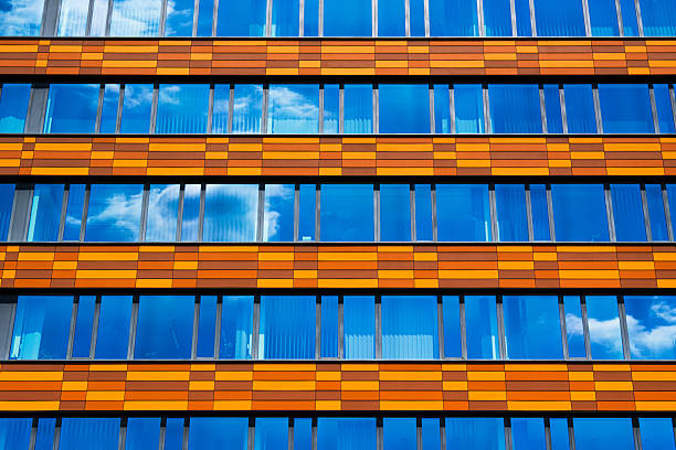 istock Office building with orange and brown horizontal panels 2226519377