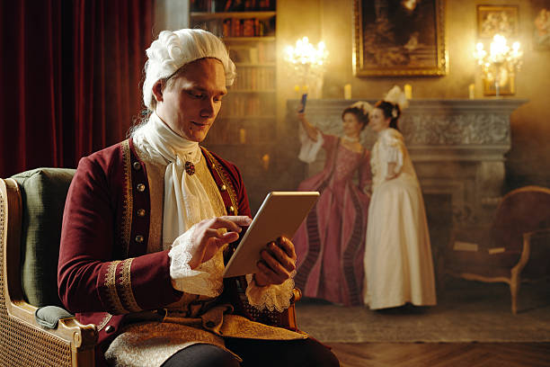 istock Caucasian Young Adult Man Using Digital Tablet in Baroque Renaissance Setting 2226521176