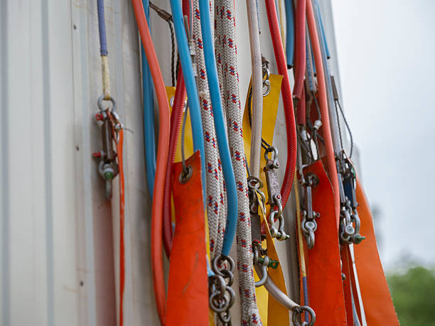 Detailed view of glider rigging equipment showing various colored ropes and connecting hardware