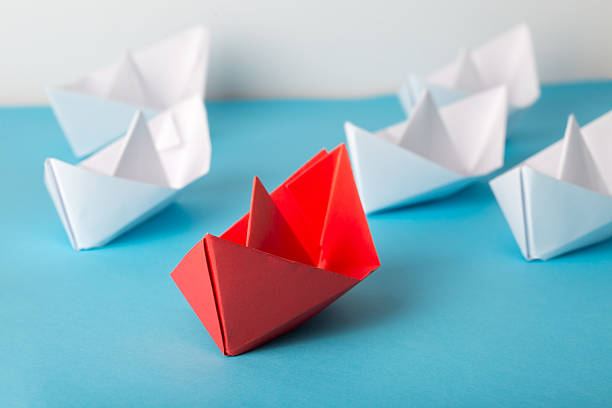 istock business leadership concept - paper boats 2226525263