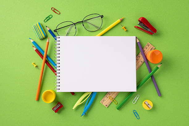istock Spiral notebook placed among various school stationery including pencils, ruler, and eraser 2226536801
