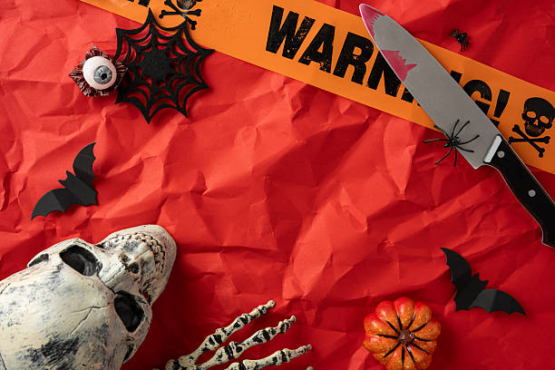 istock Creepy and festive Halloween setting featuring a skull prop, bats, spider decor, and colorful accents 2226536851