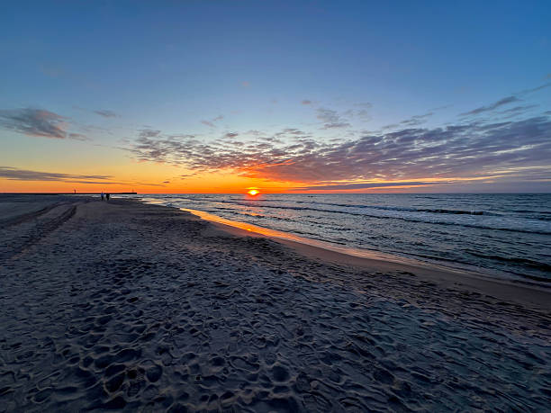 istock May sunset on the Baltic beach in Mrzezyno, Poland 2226537749