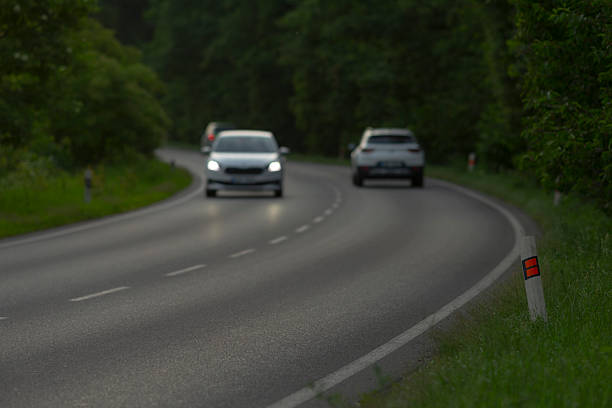istock A blurred image depicting several cars driving along a curvy road 2226550049