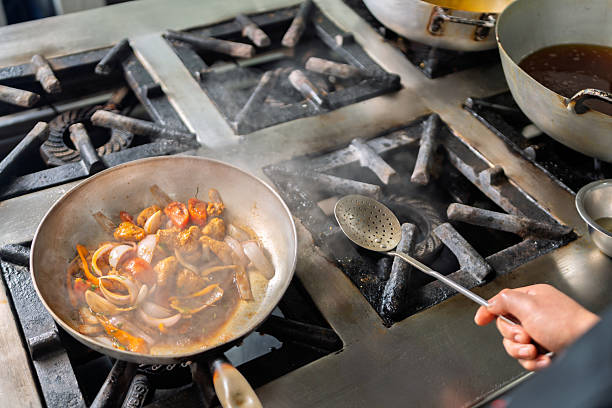 istock Chef preparing fish and seafood in a peruvian restaurant kitchen 2226551740