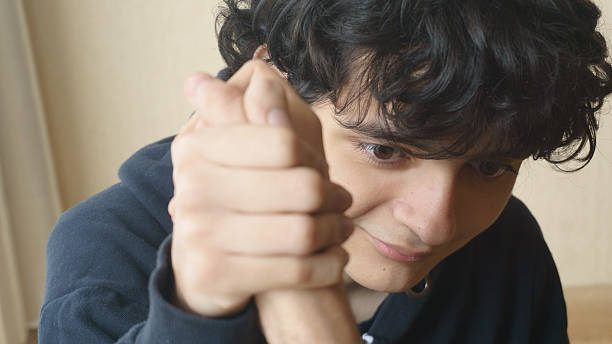 istock Face of a young man playing arm wrestling 2226552861