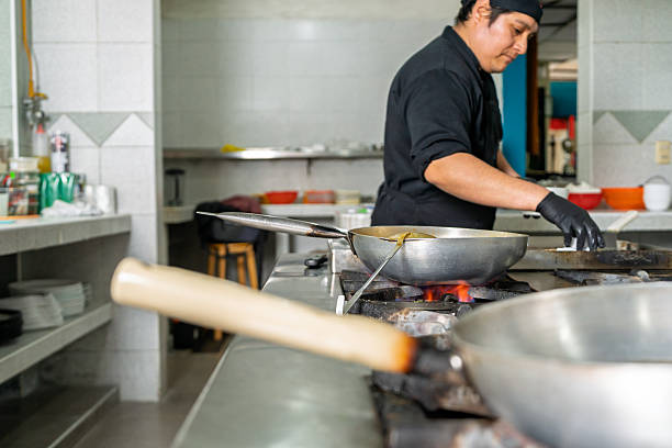 istock Professional chef cooking seafood in a restaurant kitchen 2226553496