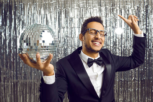 istock Overjoyed black man with disco ball partying 2226555334