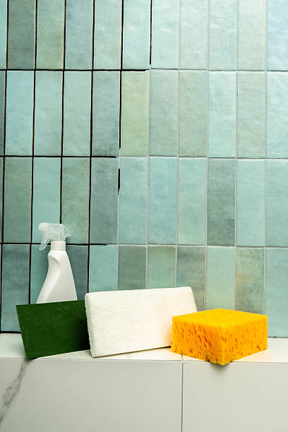 istock Cleaning tools and materials for epoxy grout repair in a tiled bathroom setting 2226555474