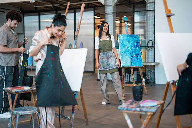 istock Young Diverse Artists Working On Canvas Paintings In Modern Art Studio Workshop 2226555642