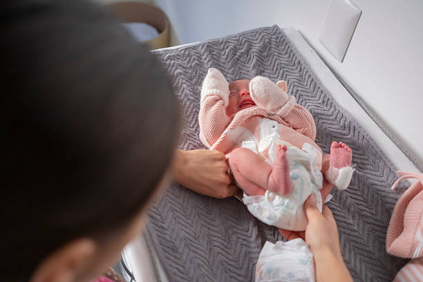 istock Newborn baby being examined and cared for at a doctor's office. 2226557020