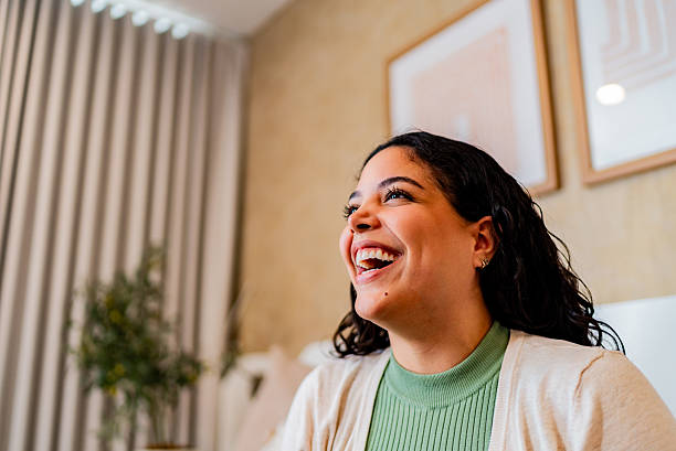 Happy young woman at home