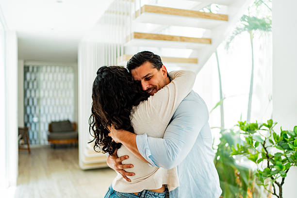 istock Couple celebrating embraced at home 2226558998