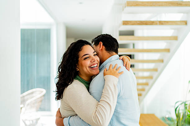 istock Couple celebrating embraced at home 2226559005