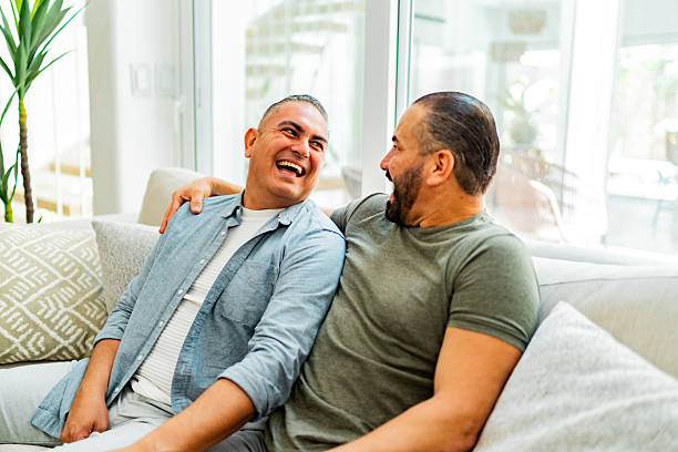 istock Gay couple talking embraced at home 2226559753