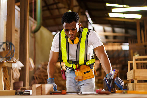 istock Professional African male carpenter is working professionally in sawmill - workshop. 2226559913