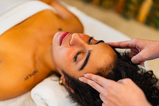 istock Young woman getting head massage at spa 2226560238