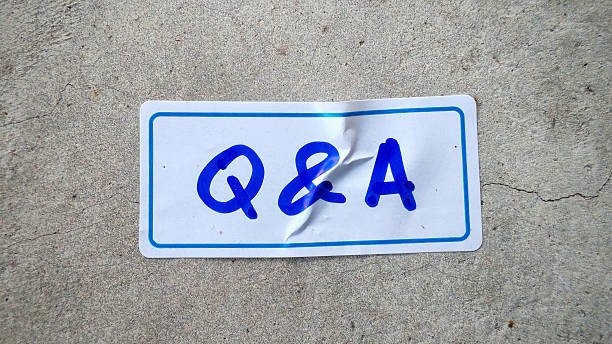 istock Q&A Text on a Crinkled Label with a Blue Border on Concrete 2226562419