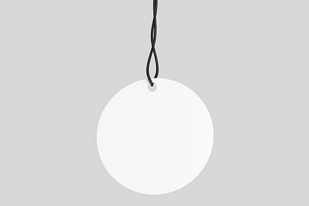 istock 3D blank circle cardboard paper hang tags, price tags or cloth labels mockup with string isolated on background. Tag realistic template for presents branding, shopping label, wedding tag, gift tag 2226564668
