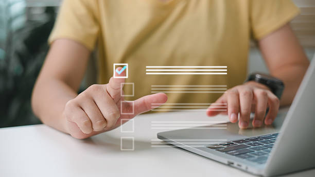 istock Person selecting digital checklist item on screen, representing task management, productivity tools, online planning, goal tracking, and remote work efficiency. 2226566501