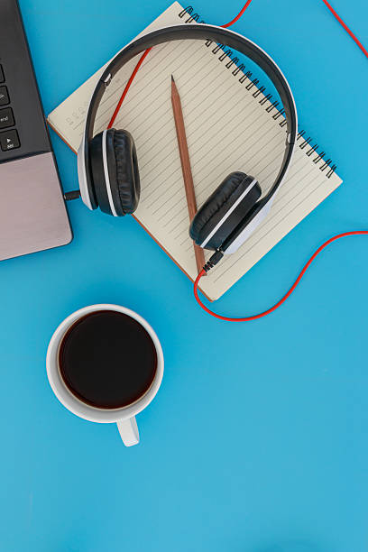 istock Coffee cup and headphones from  laptop computer . 2226566602