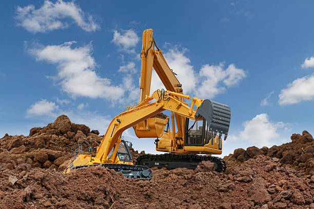 istock Two excavator  are digging  soil in the construction site . 2226566668