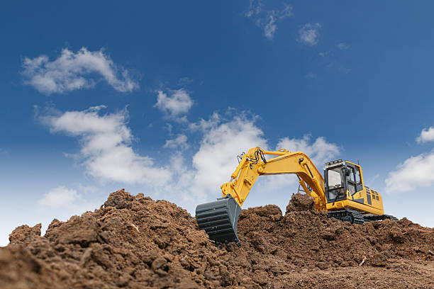 istock Excavator with bucket lift up  are digging  soil . 2226566702