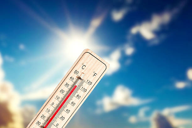 istock Sun, blue skies and a thermometer that shows high temperatures in summer 2226570270