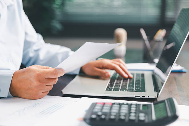 istock Office businesswoman hand to operate calculator analyzing financial data, counting costs on desk. accounting, financial analysis for business budget planning, calculation support, finance management. 2226572438