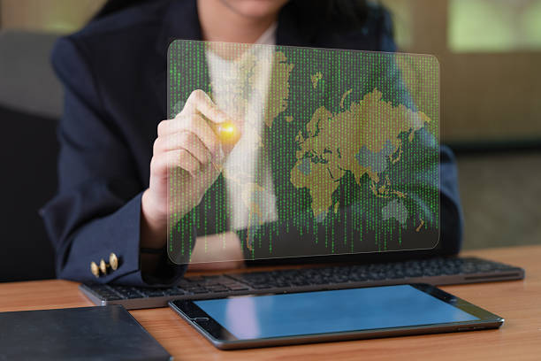 istock A woman in a business suit interacts with a virtual network. 2226575755