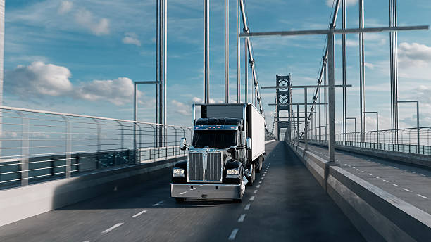 istock American style truck on freeway pulling load. Transportation theme. 3D illustration 2226576127