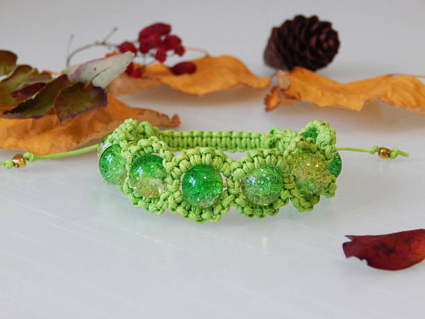 istock Bead green bracelet and leafs 2226581100
