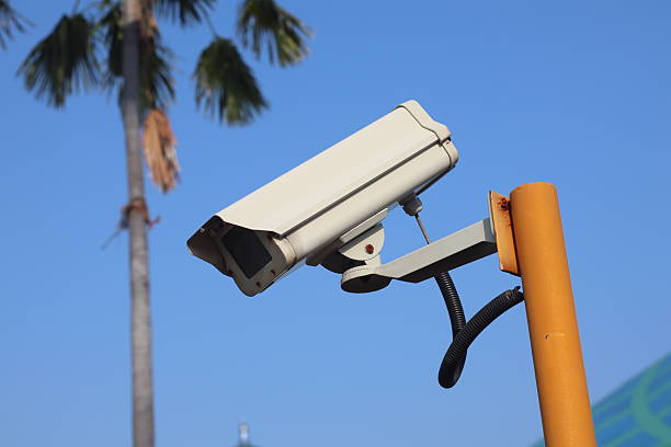 An outdoor surveillance camera is a ruggedized security camera designed to withstand various weather conditions and harsh environments, typically placed outside to monitor areas like driveways, yards, or building perimeters.