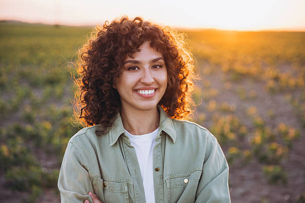 istock Young agronomist smiling in cultivated soybean field at sunset 2226588308