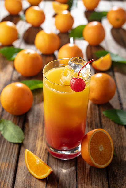 istock Classic tequila sunrise cocktail on an old wooden table. 2226590373