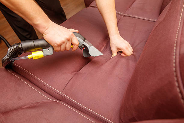 istock A person is cleaning a couch with a vacuum 2226590396