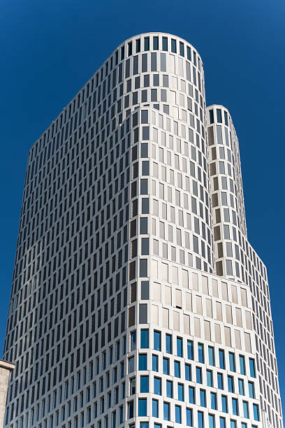 Zoofenster Building Full Height. A striking view of the Zoofenster building highlights its full height and uniform window pattern. The architecture is distinctly modern and symmetrical.