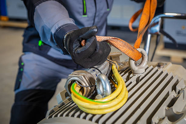 istock Worker securing electric motor with lifting sling for transportation 2226592335